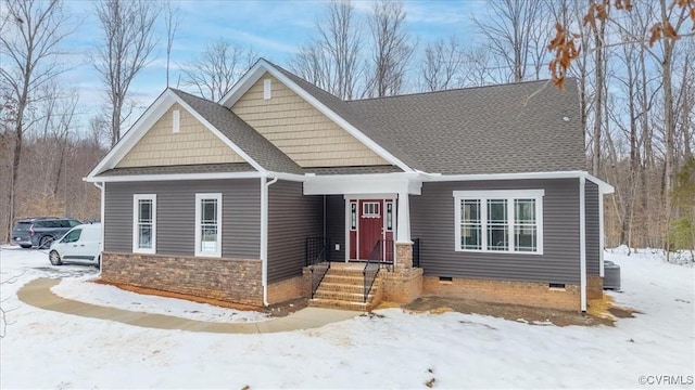 craftsman-style house with central air condition unit