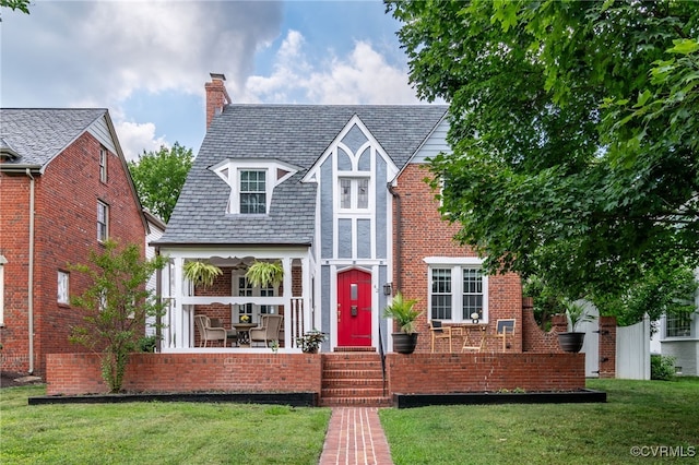 tudor house with a front yard