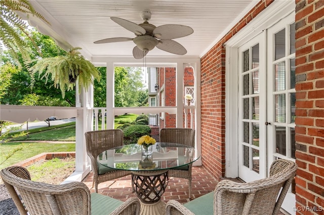 sunroom / solarium with ceiling fan