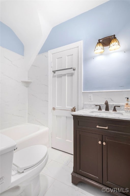 full bathroom featuring vanity, toilet, bathtub / shower combination, and vaulted ceiling