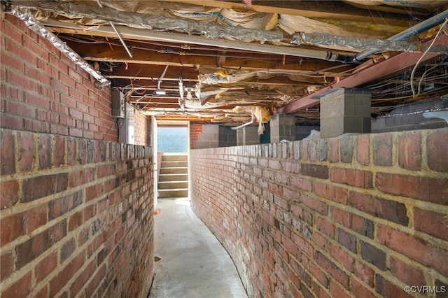 basement with brick wall