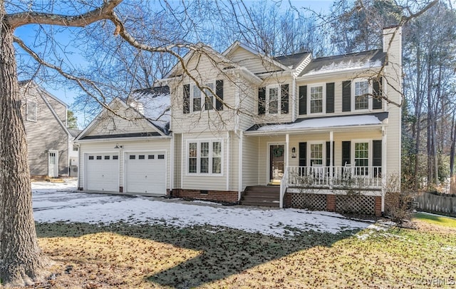 view of front facade with a porch and a garage