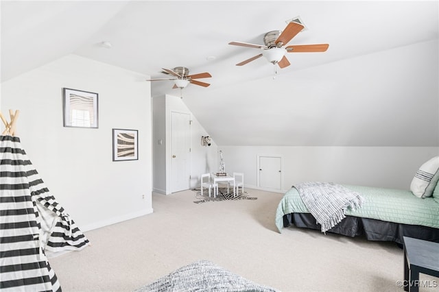 carpeted bedroom with vaulted ceiling and ceiling fan