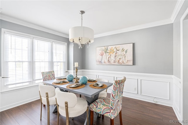 dining area featuring dark hardwood / wood-style flooring and crown molding