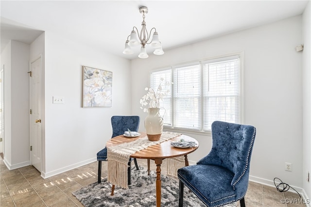 sitting room featuring tile patterned floors and an inviting chandelier