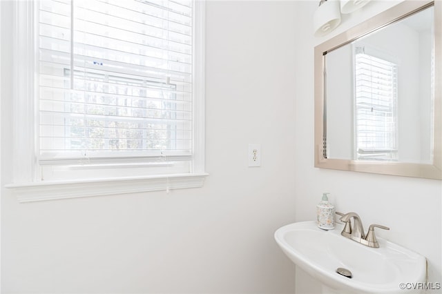 bathroom with sink and a healthy amount of sunlight