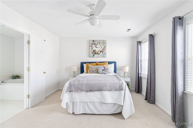 bedroom featuring ceiling fan and light colored carpet