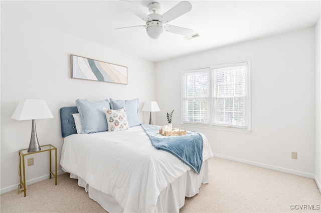 bedroom featuring ceiling fan and light carpet