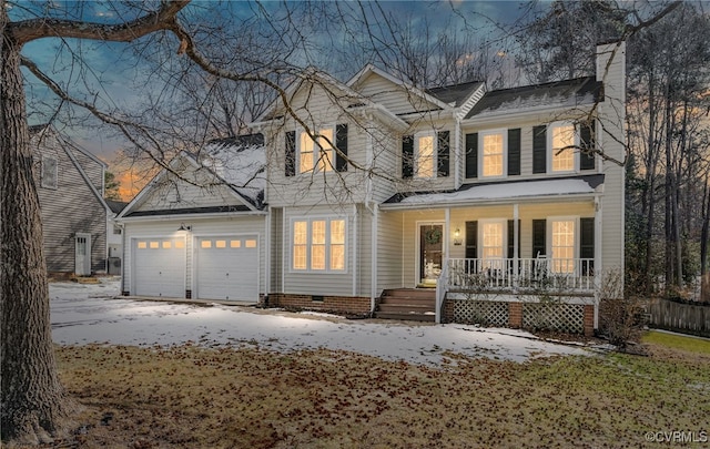 view of front of property featuring a porch and a garage