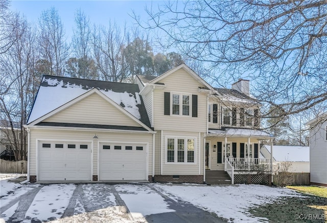 front of property featuring a garage and a porch