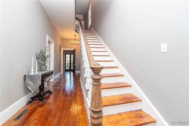 stairs with hardwood / wood-style flooring