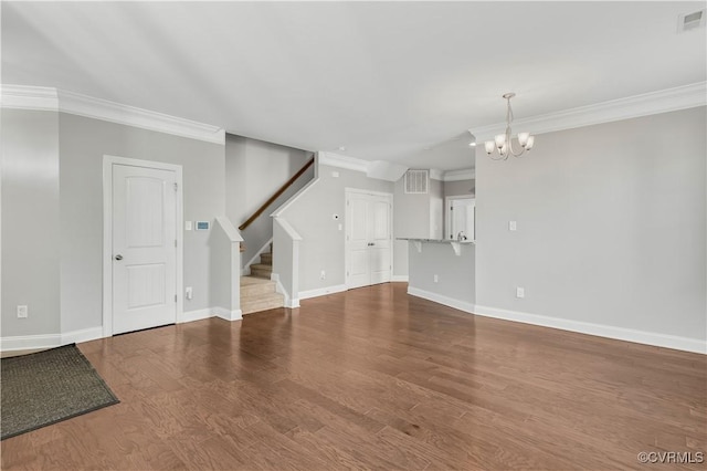 unfurnished living room featuring hardwood / wood-style floors, ornamental molding, and a chandelier