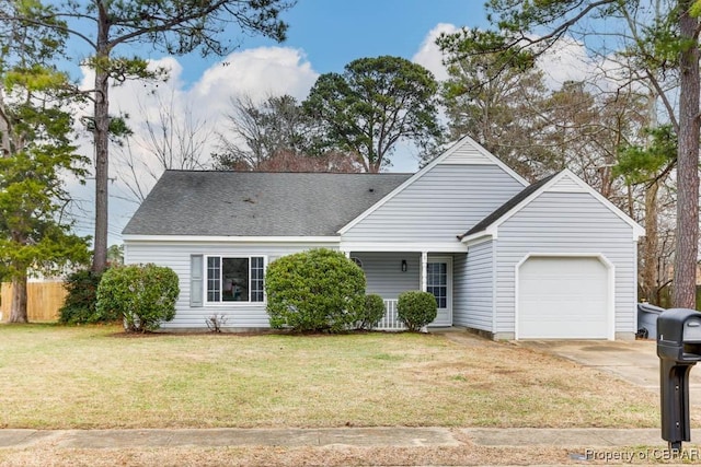 view of front facade with a garage and a front lawn