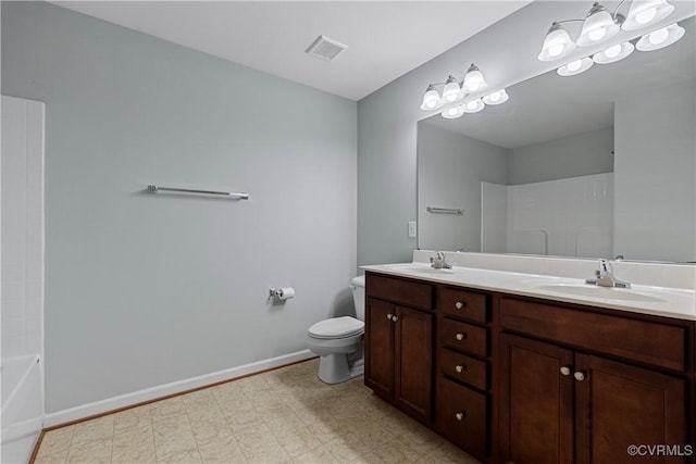 bathroom featuring toilet and vanity