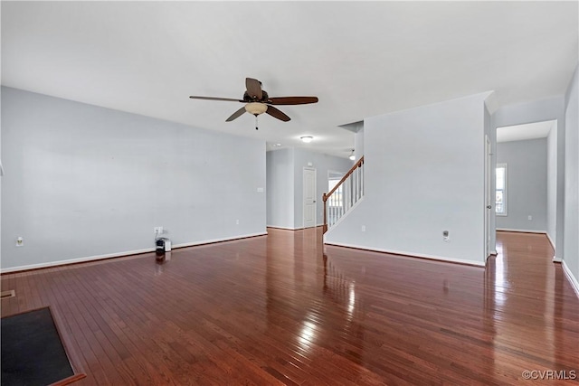 spare room with ceiling fan and dark hardwood / wood-style floors