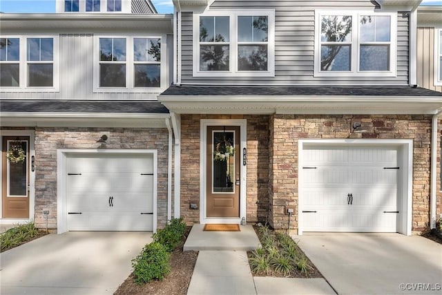 view of exterior entry with a garage