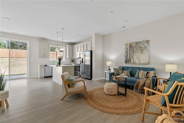 living room with light hardwood / wood-style flooring