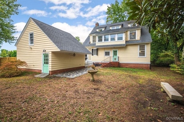 back of house with a patio and fence