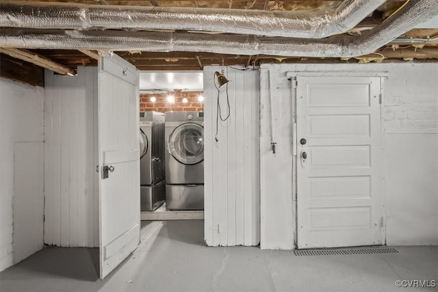 unfinished below grade area featuring washer and clothes dryer