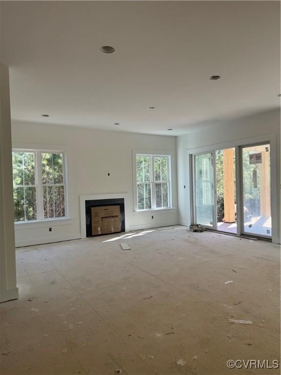 unfurnished living room featuring a fireplace