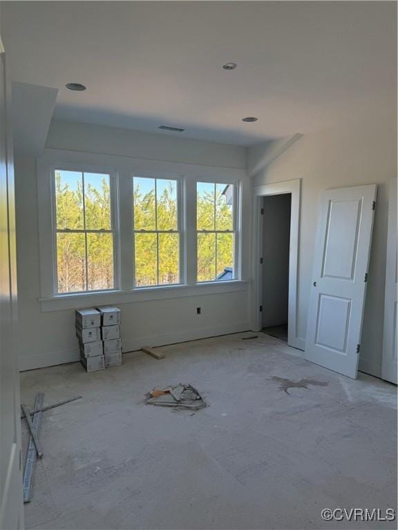 spare room with visible vents and baseboards