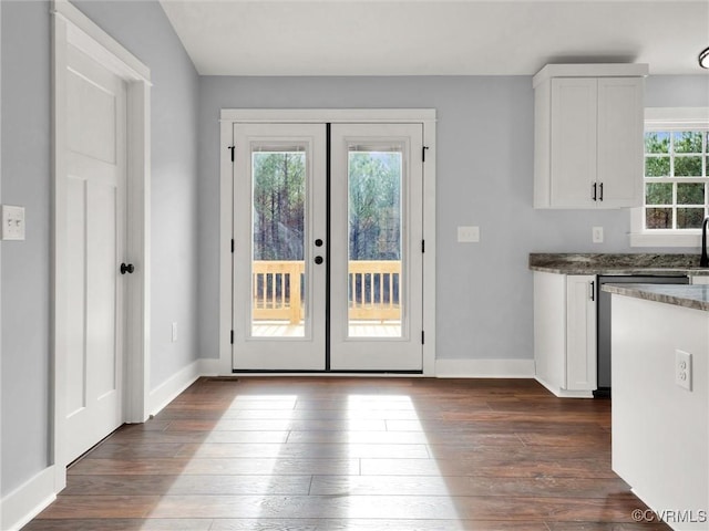 doorway to outside featuring french doors and dark wood-type flooring