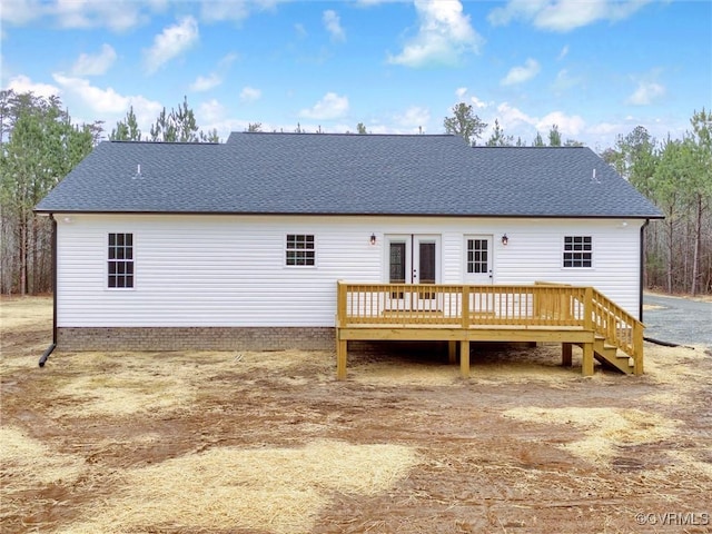 rear view of house featuring a deck