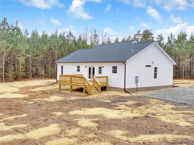 back of house with a wooden deck