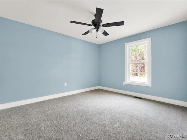 carpeted empty room with ceiling fan