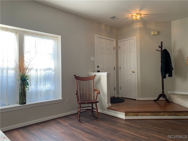 sitting room with dark hardwood / wood-style floors