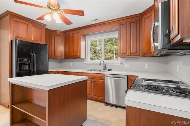 kitchen featuring a kitchen island, stovetop, sink, black fridge with ice dispenser, and stainless steel dishwasher