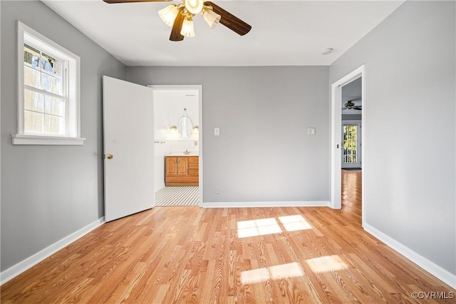 unfurnished room featuring ceiling fan and light hardwood / wood-style floors