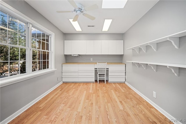 interior space featuring ceiling fan, a healthy amount of sunlight, and light hardwood / wood-style floors