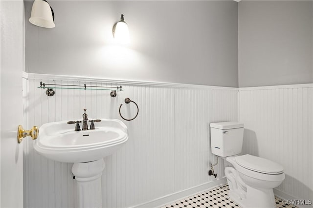 bathroom featuring tile patterned floors and toilet