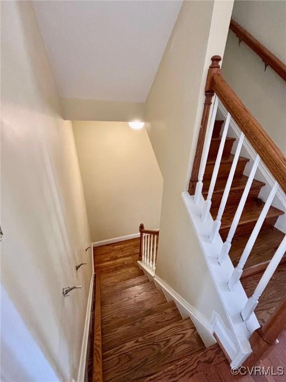 stairway featuring hardwood / wood-style flooring