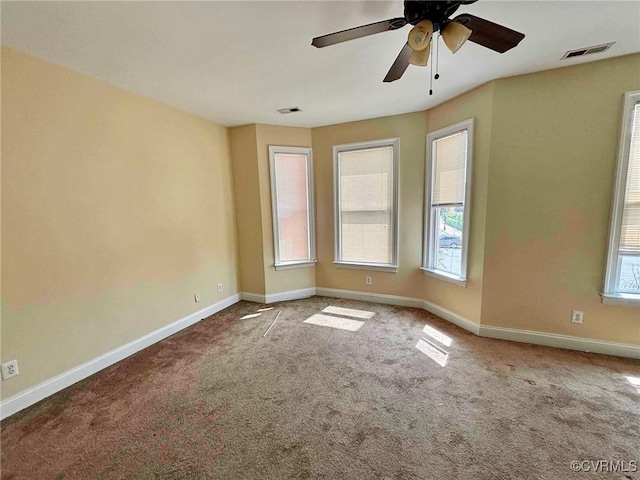 spare room with carpet flooring and ceiling fan