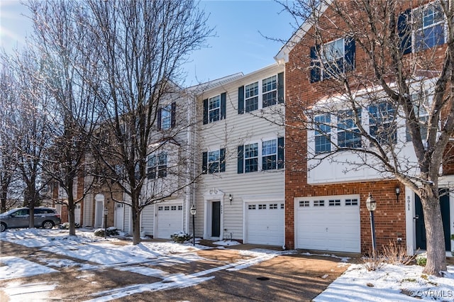 townhome / multi-family property featuring a garage