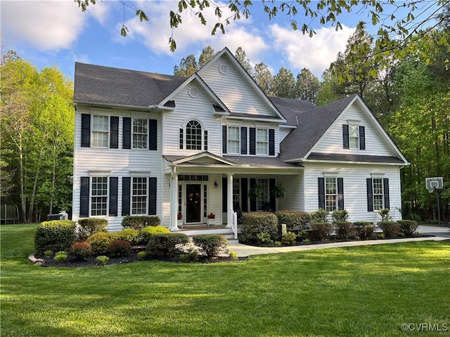 view of front facade featuring a front lawn and covered porch