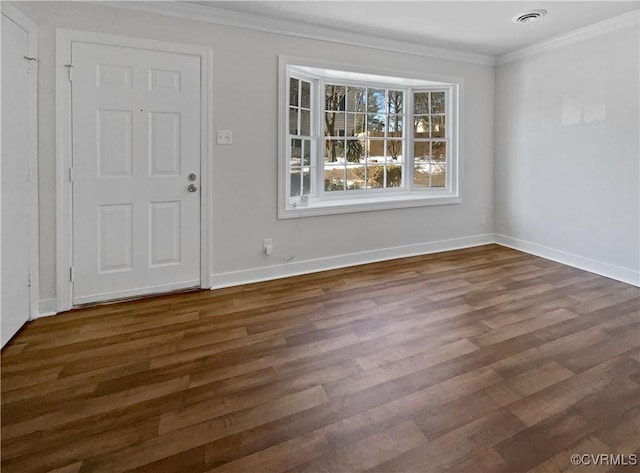 unfurnished dining area featuring dark hardwood / wood-style floors and crown molding