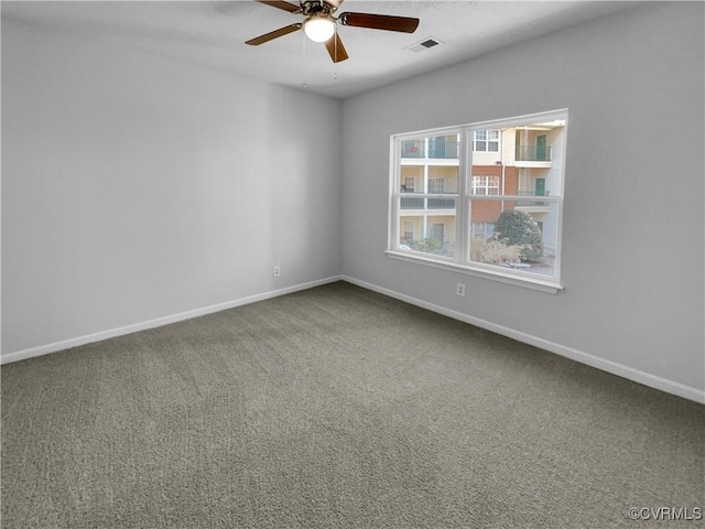 unfurnished room featuring carpet and ceiling fan