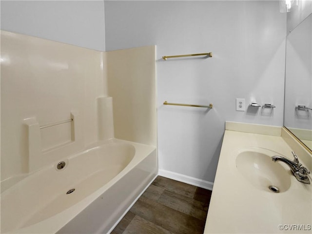 bathroom featuring sink and hardwood / wood-style floors