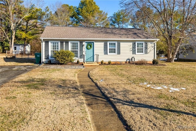 ranch-style house featuring a front yard