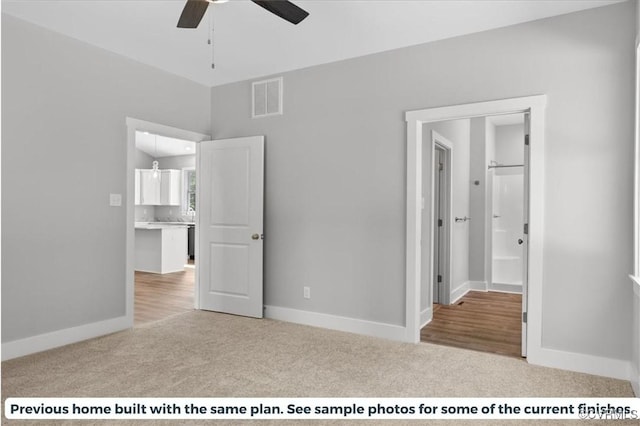 unfurnished bedroom featuring baseboards, visible vents, and carpet flooring