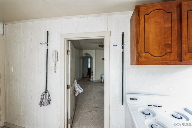 interior space featuring wood walls and washer / clothes dryer