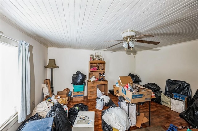 interior space with ceiling fan, dark parquet flooring, and a baseboard radiator