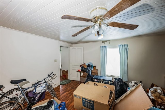 miscellaneous room featuring ceiling fan, dark wood-type flooring, crown molding, and wood ceiling