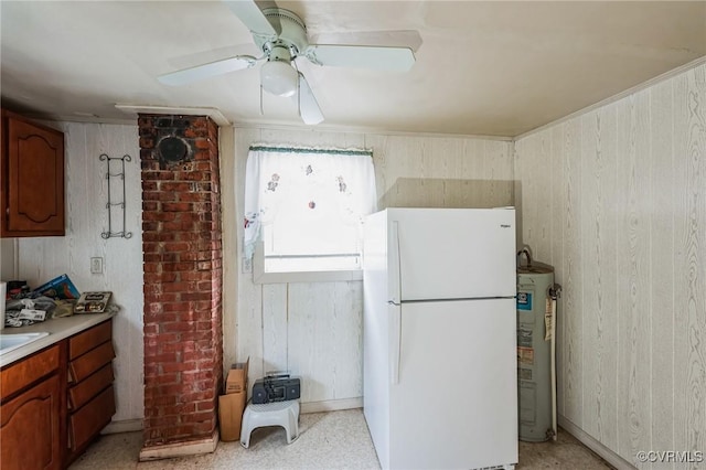 kitchen featuring ceiling fan, electric water heater, and white fridge