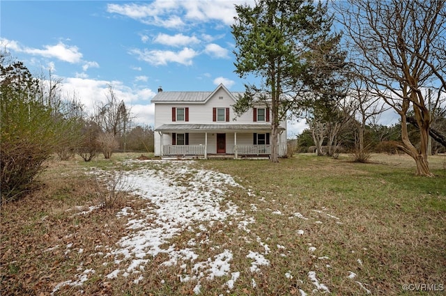 view of front of house with a front yard and a porch