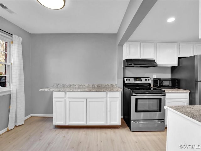 kitchen featuring stainless steel appliances, white cabinetry, light wood-type flooring, and light stone countertops