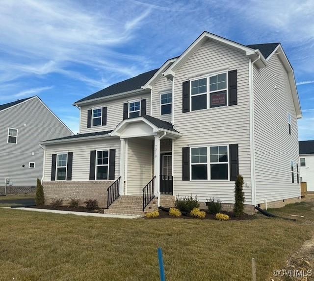 view of front facade with a front lawn